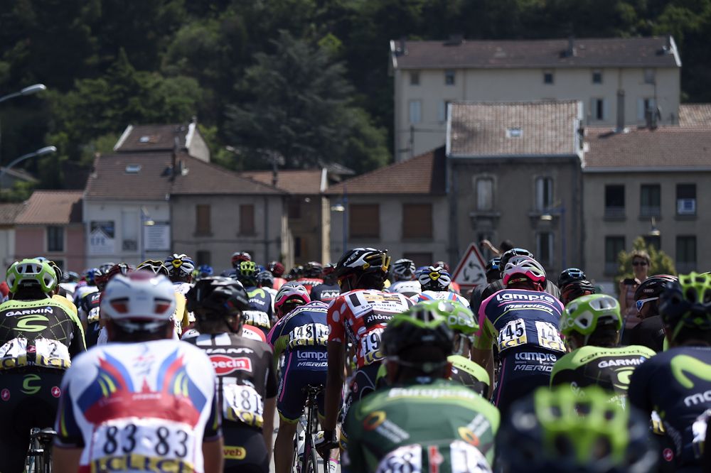 The peloton rolls through a small village during stage 4.