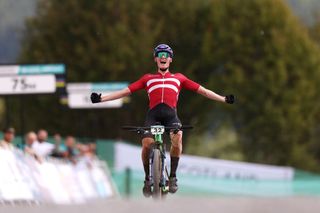GLENTRESS FOREST PEEBLES SCOTLAND AUGUST 10 Albert Philipsen of Denmark celebrates at finish line as race winner during Men Junior Crosscountry Olympic at the 96th UCI Cycling World Championships Glasgow 2023 Day 8 UCIWT on August 10 2023 in Glentress Forest Peebles Scotland Photo by Dean MouhtaropoulosGetty Images