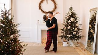 Couple kissing at Christmas