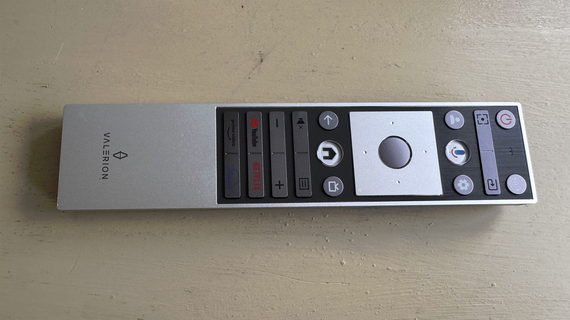 Valerion VisionMaster Pro 2 home cinema projector remote control on white surface