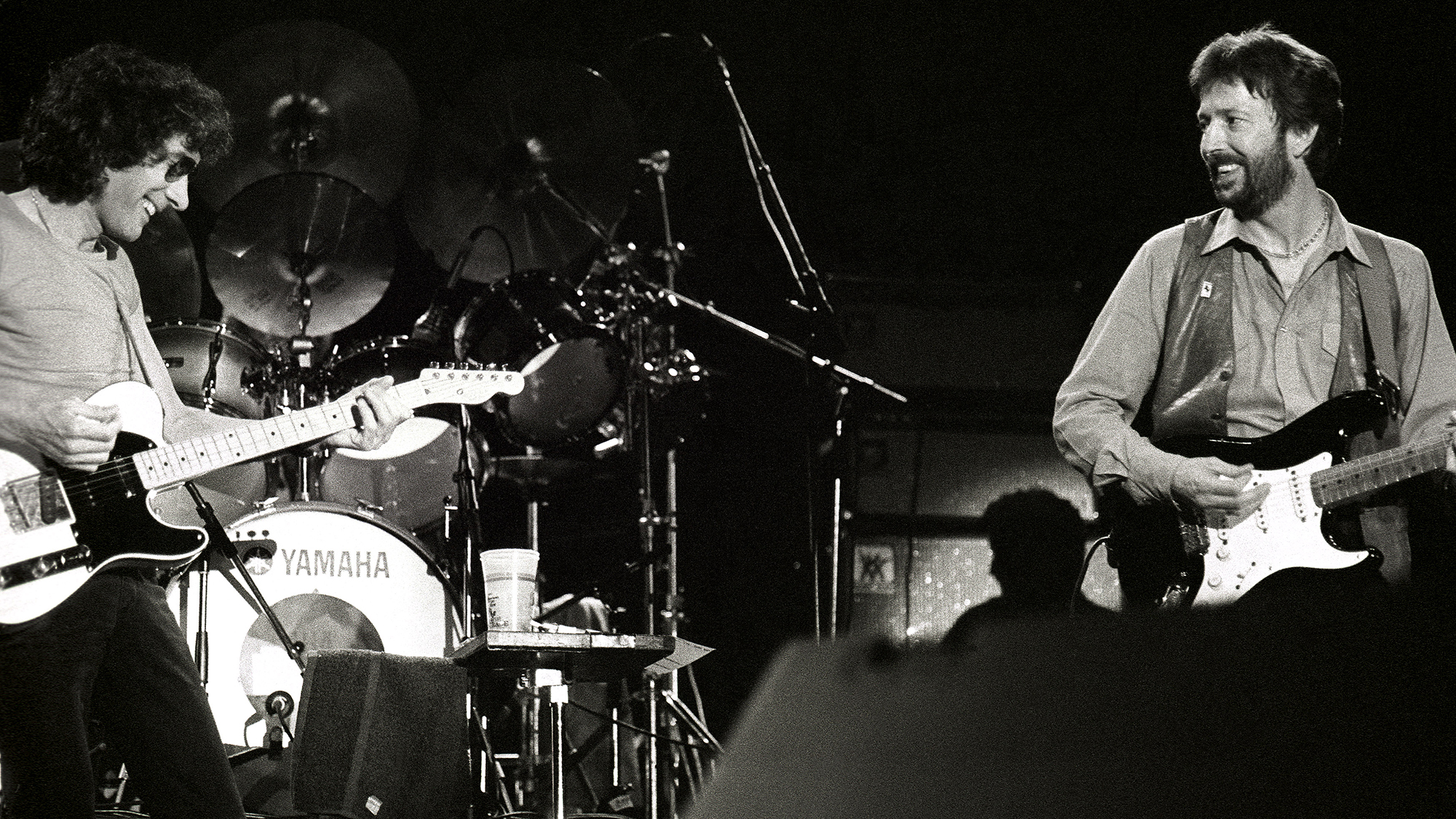 Albert Lee performs on stage with Eric Clapton at Ahoy, Rotterdam, Netherlands, 23rd April 1983 