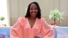 Angelica Bell in coral Queens of Archive dress