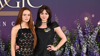 Maisie Williams and Joey King posting together at the Practical Magic 2 London Premiere. 