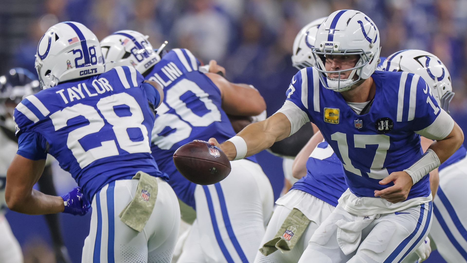 Daniel Jones handing the ball off to Indianapolis Colts teammate Jonathan Taylor during a 2025 NFL game