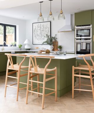 Budget kitchen with green wall, wood cabinet