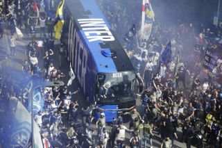 Inter Milan fans welcome the team bus ahead of the Serie A champions' game against Sampdoria