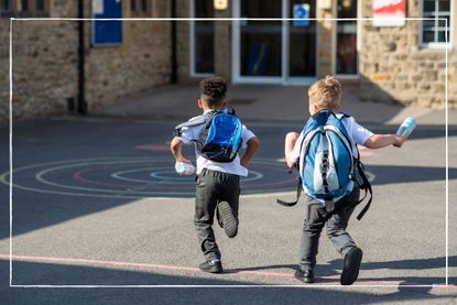 How hot does it have to be for schools to close illustrated by Two children running across playground