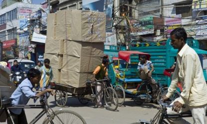 A crowded street in Old Delhi, India: Thanks to complicated and corrupt politics, India's emerging economy is petering out.