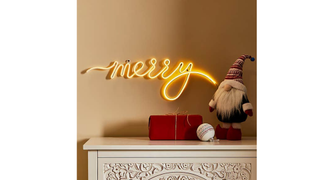 A simple neon tube light that spells out the word Merry, one of this year's best Christmas lights.