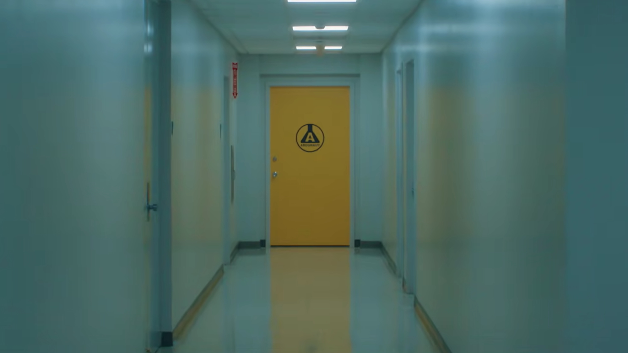 Long hallway with a mysterious, closed yellow door at the end in Crystal Lake Season 1