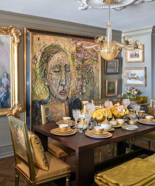 dining room with large artwork and vintage light fitting