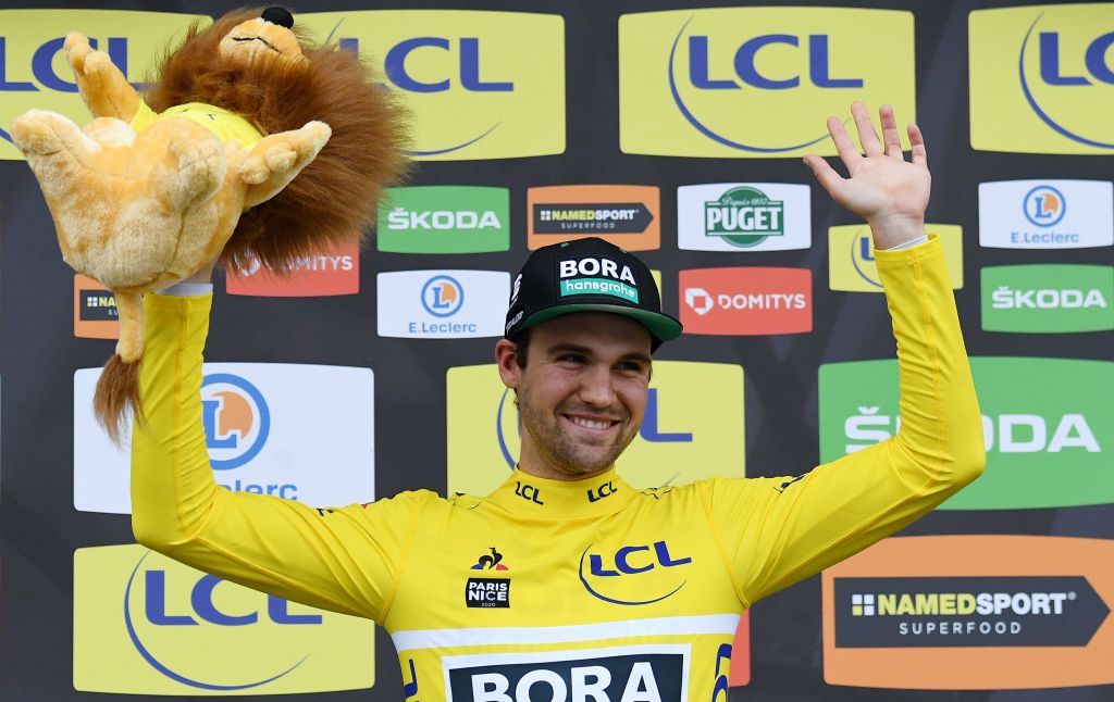 BORA hansgrohe German rider Maximilian Schachmann celebrates his overall leader yellow jersey on the podium at the end of the 2125 km 3rd stage of the 78th Paris Nice cycling race stage between ChalettesurLoing and La Chatre on March 10 2020 Photo by Alain JOCARD AFP Photo by ALAIN JOCARDAFP via Getty Images