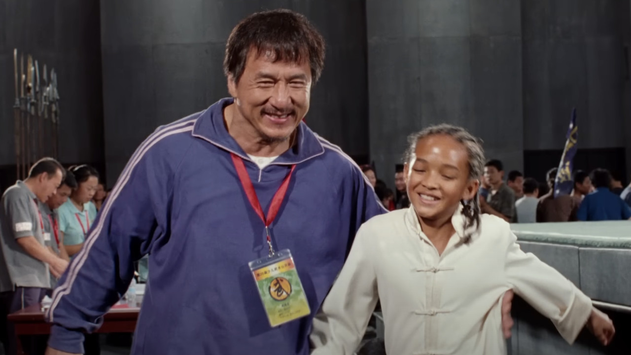 Mr. Han (Jackie Chan) and Dre Parker (Jaden Smith) celebrate after the kung fun tournament