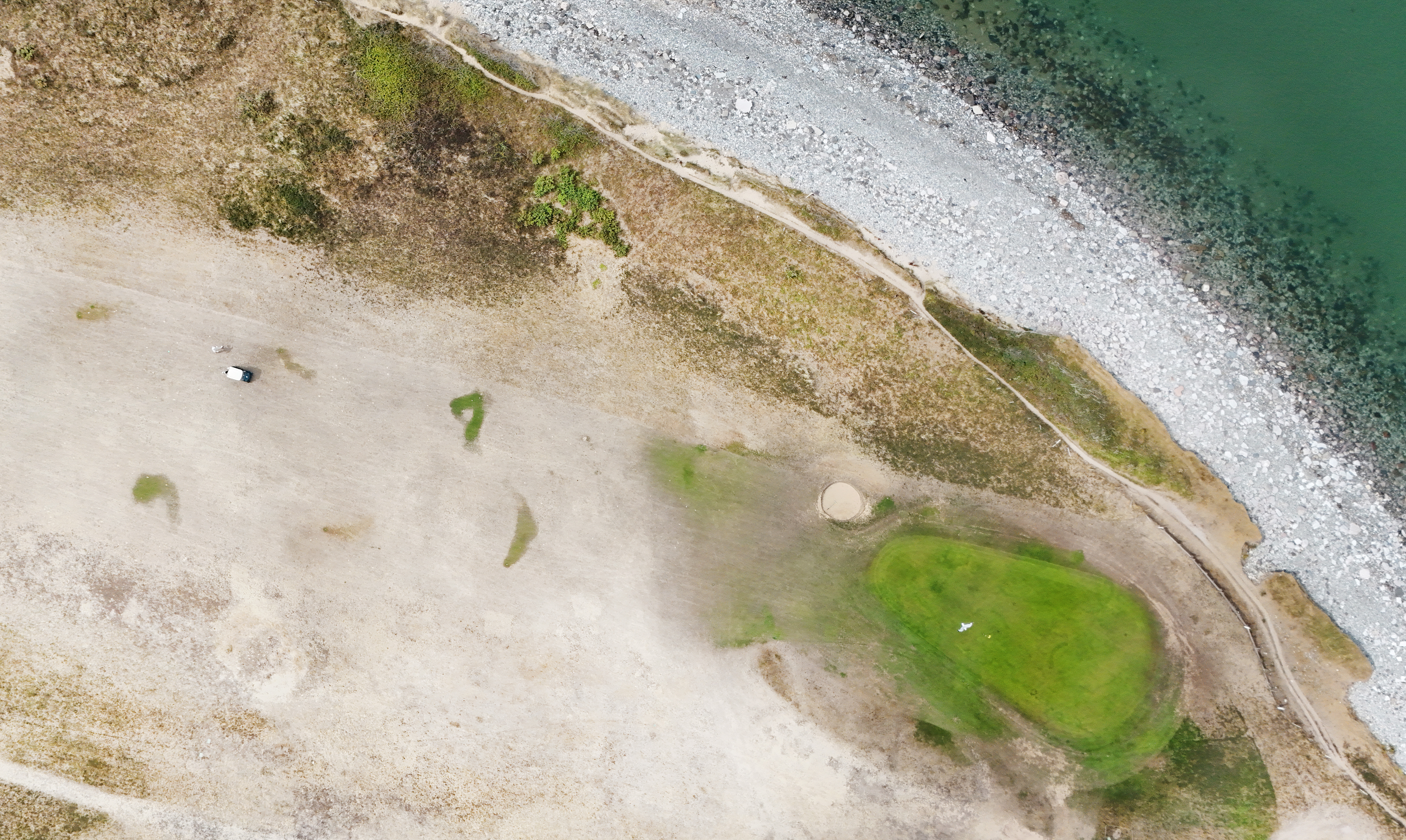 A golf course seen from above during the 2026 UK summer drought
