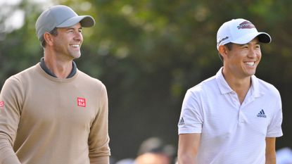 Adam Scott jokes with Collin Morikawa at the 2022 Genesis Invitational