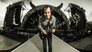 AC/DC's Angus Young poses as he warms up at the soundcheck for the opening night of the Rock Or Bust Tour At the Passeio Maritimo De Alges on May 6, 2016 in Lisbon, Portugal