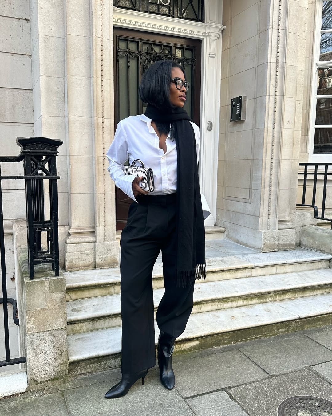 @nlmarilyn wearing ankle boots with black trousers and shirt
