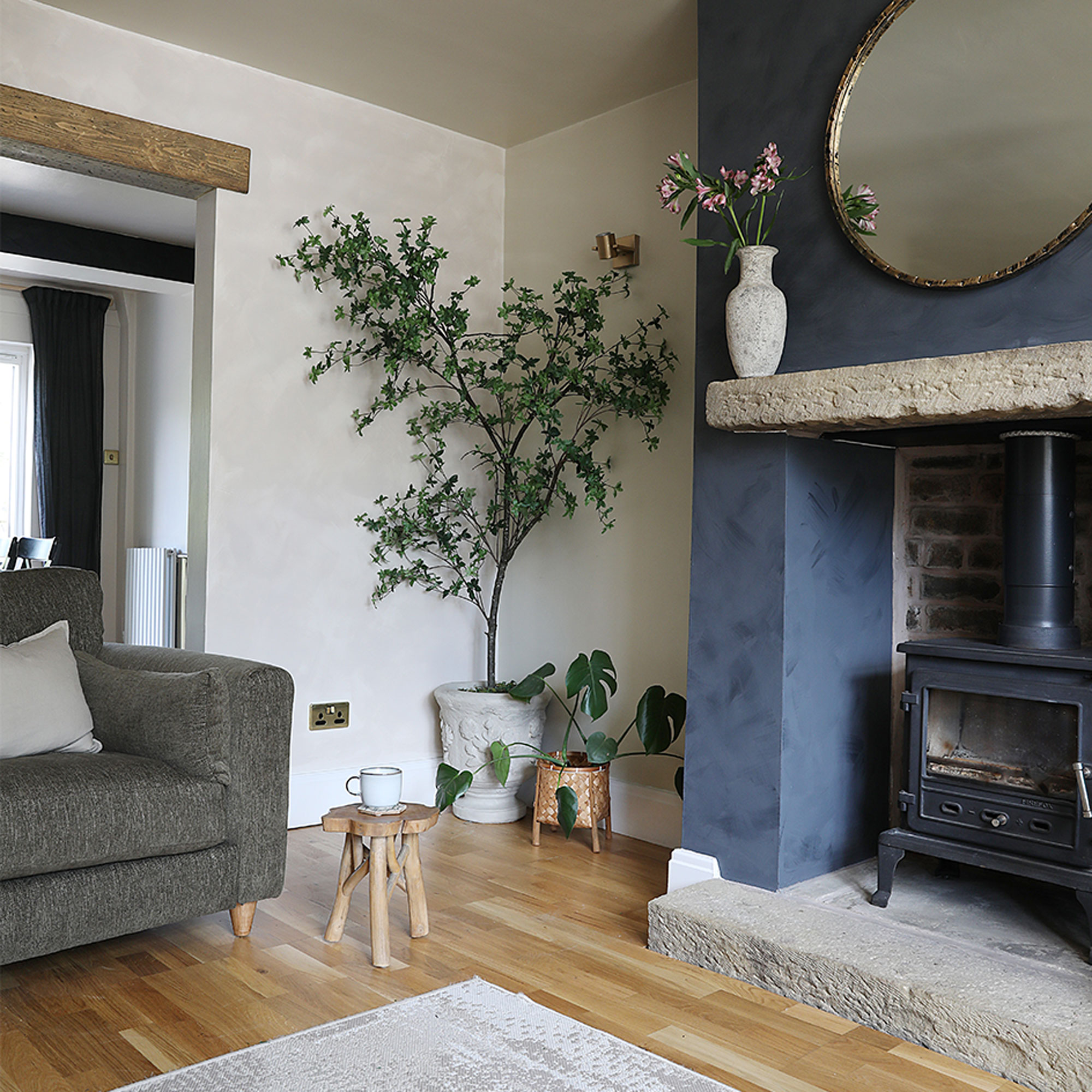 through living room with fireplace and woodburner
