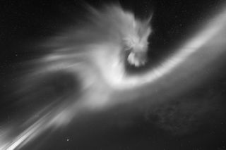 The photographer was able to capture the aurora in motion when it turned into something resembling a dragon’s head on a clear night. Telser chose to use black and white to emphasise the contrast of the aurora against the dark sky