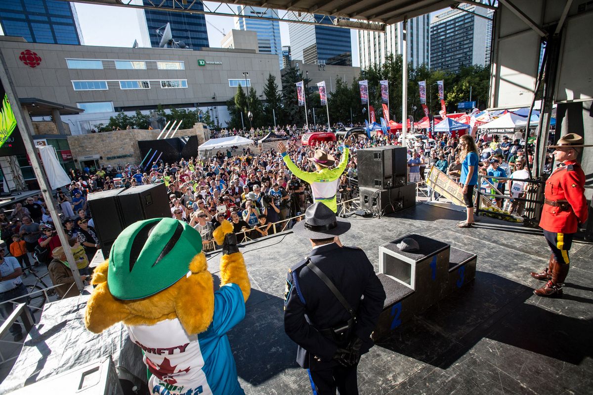 Evan Huffman (Rally Cycling) waves from the podium