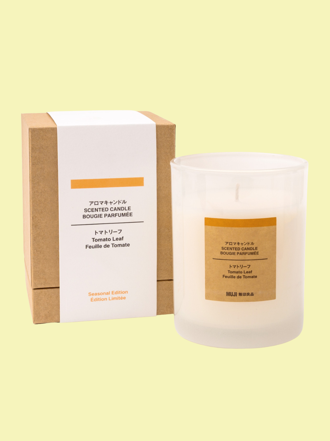 A glass tomato leaf candle from MUJI
