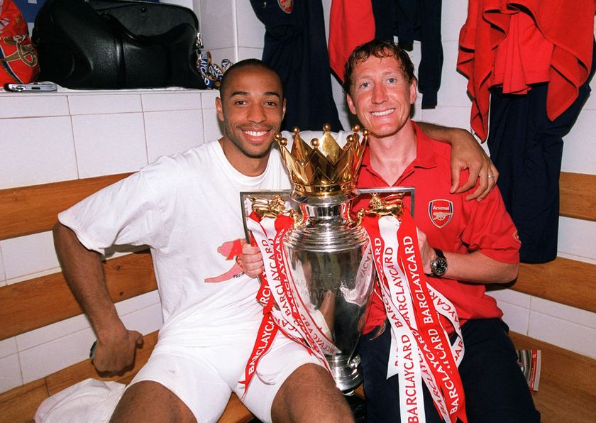 LONDON, ENGLAND - MAY 15: Thierry Henry and Ray Parlour of Arsenal with the Premier League trophy after the match between Arsenal and Leicester City in the Premier League at Highbury on May 15, 2004 in London, England. (Photo by Stuart MacFarlane/Arsenal FC via Getty Images)