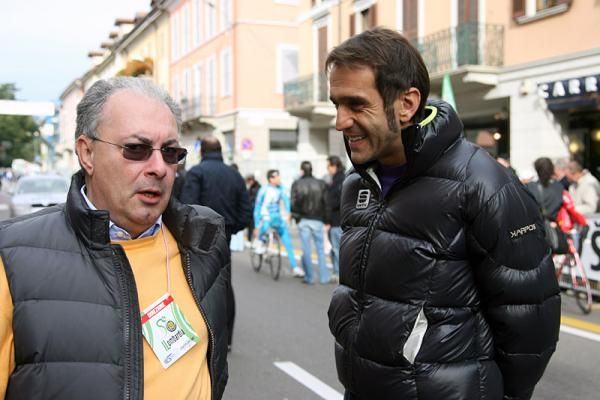 Giro d'Italia director Angelo Zomegnan, left, and Franco Ballerini chat before the start of the Giro di Lombardia.