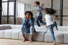 mum on sofa with kids 