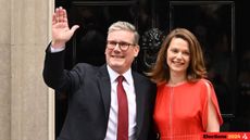 Labour leader and incoming Prime Minister Sir Keir Starmer and wife Victoria greet supporters as they enter 10 Downing Street following Labour's landslide election victory on 5 July 2024.