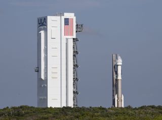 The Starliner capsule and Atlas V rocket nearly back to the Vertical Integration Facility on Aug. 5, 2021.