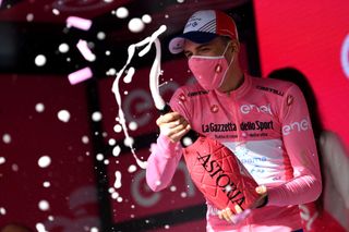 ASCOLI PICENO SAN GIACOMO ITALY MAY 13 Attila Valter of Hungary and Team Groupama FDJ Pink Leader Jersey celebrates at podium during the 104th Giro dItalia 2021 Stage 6 a 160km stage from Grotte di Frasassi to Ascoli Piceno San Giacomo 1090m Mask Covid safety measures Champagne girodiitalia Giro UCIworldtour on May 13 2021 in Ascoli Piceno San Giacomo Italy Photo by Tim de WaeleGetty Images