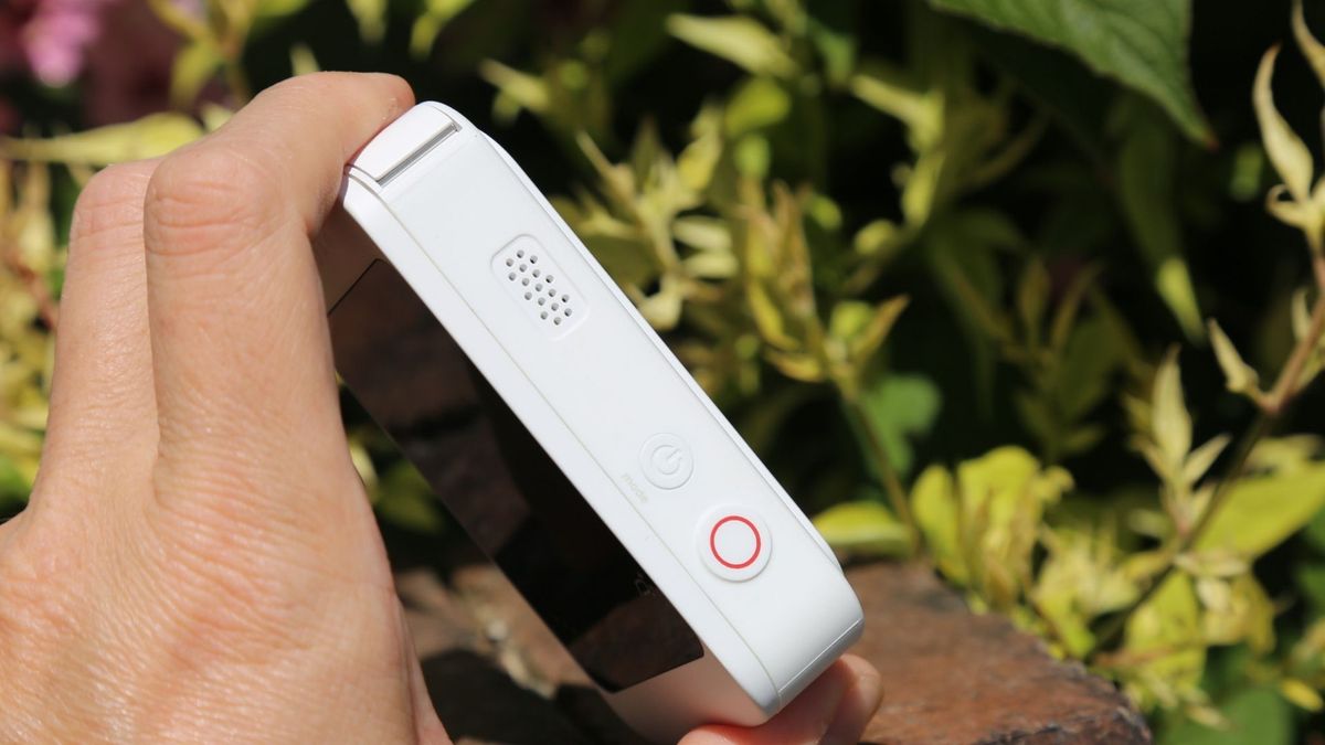 A hand holding the Kandao Qoocam Ego 3D camera