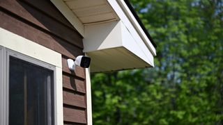 Vivint Deck Pro Camera on the corner of a wooden house