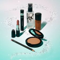 MAC beauty products on a glittery blue background for Black Friday