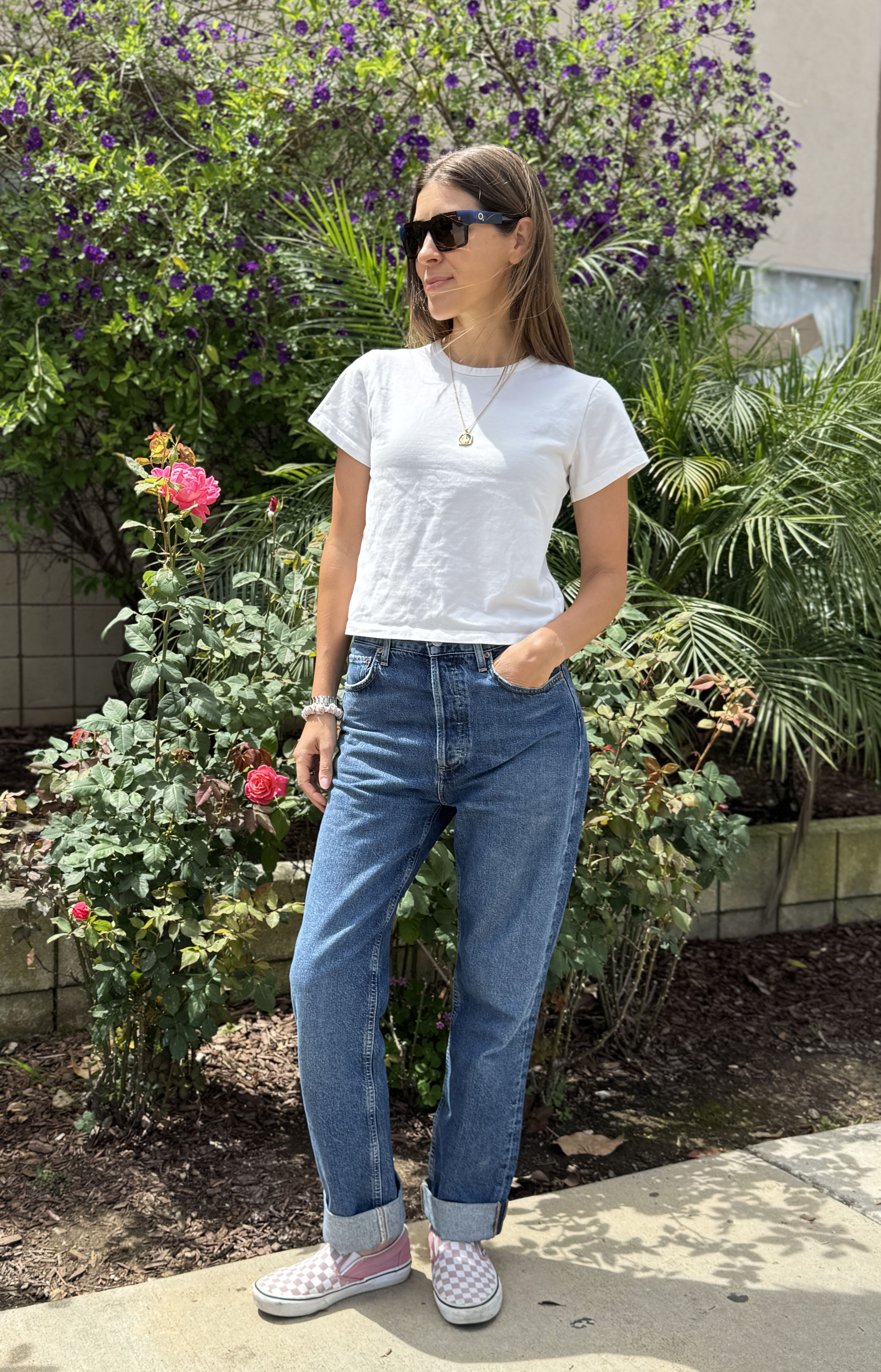 Judith Jones wearing a white tee and Agolde jeans.