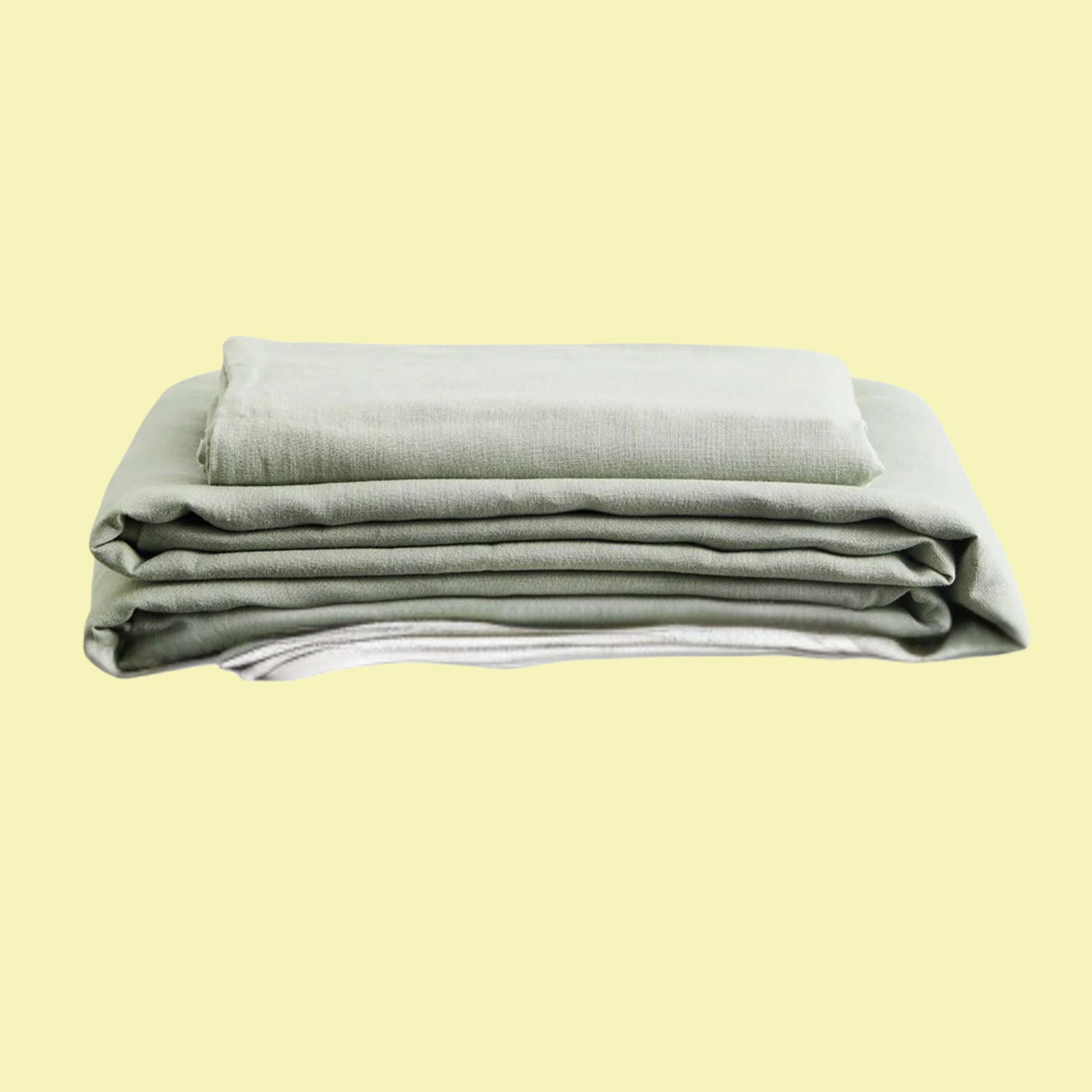 A set of folded sage sheets and pillowcases