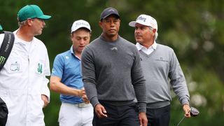 Tiger Woods during a practice round with Justin Thomas and Fred Couples