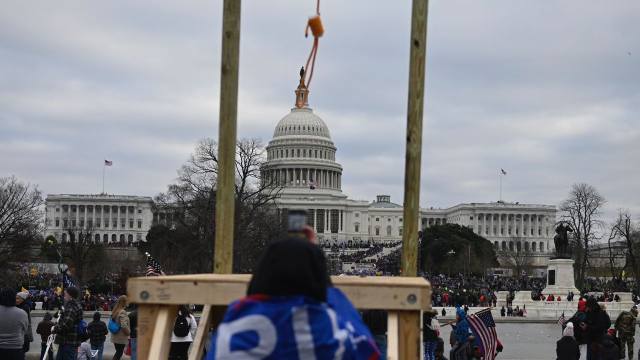 Supporters of US President Donald Trump gather across from the US Capitol