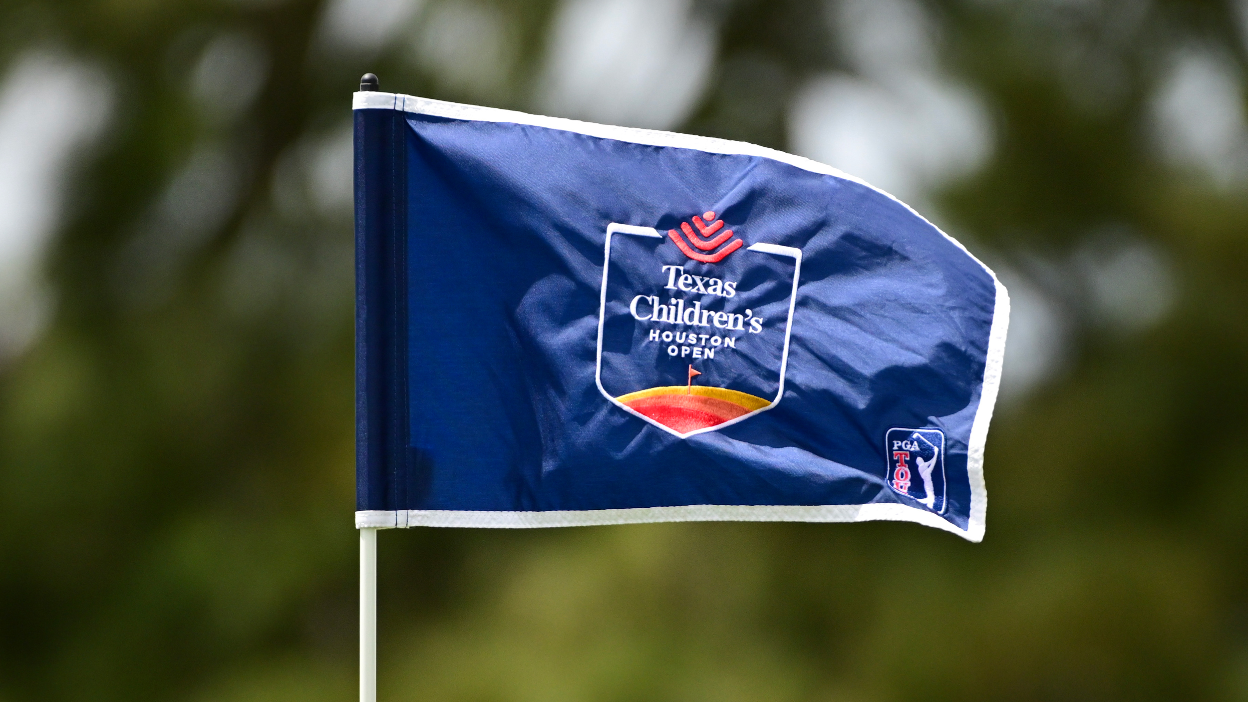 A blue Texas Children's Houston Open PGA Tour flag 