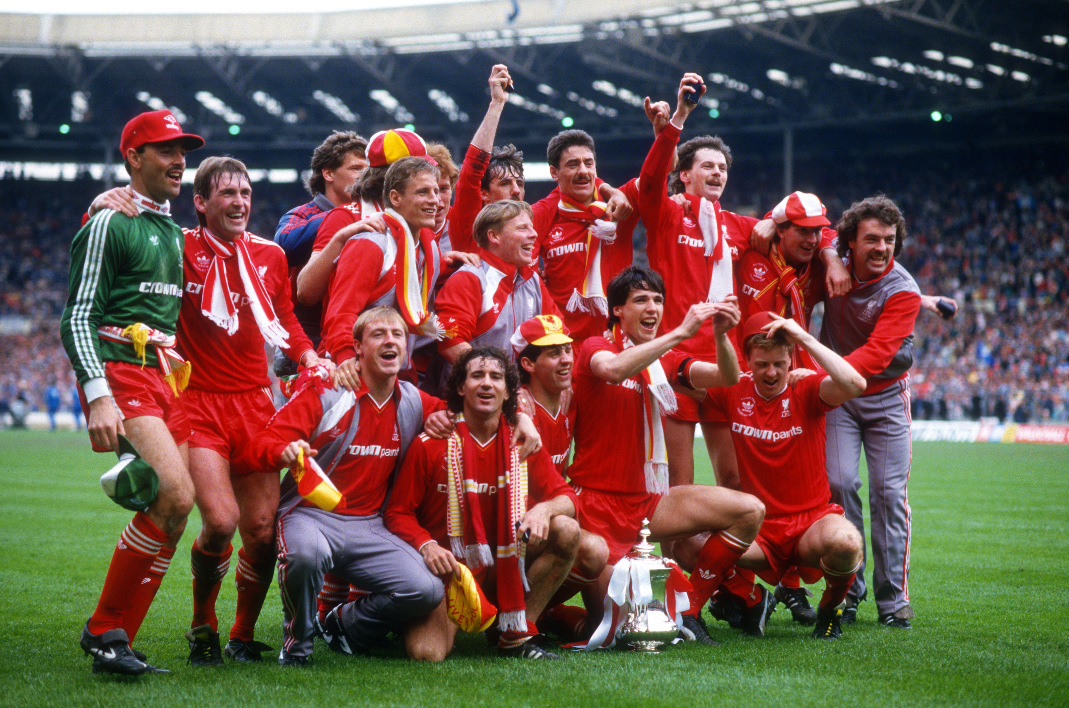 Liverpool players celebrate with the FA Cup after victory over Everton in the final at Wembley in May 1986.