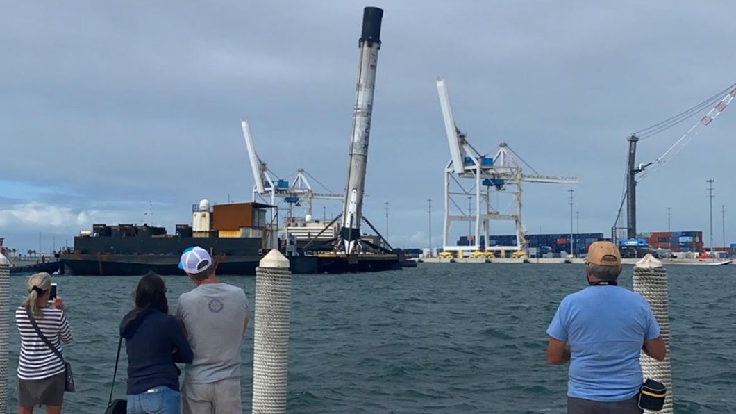 A SpaceX Falcon 9 booster returns to shore with a lean, on Nov. 19, 2020.