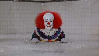 Tim Curry as Pennywise in drain 1990 IT