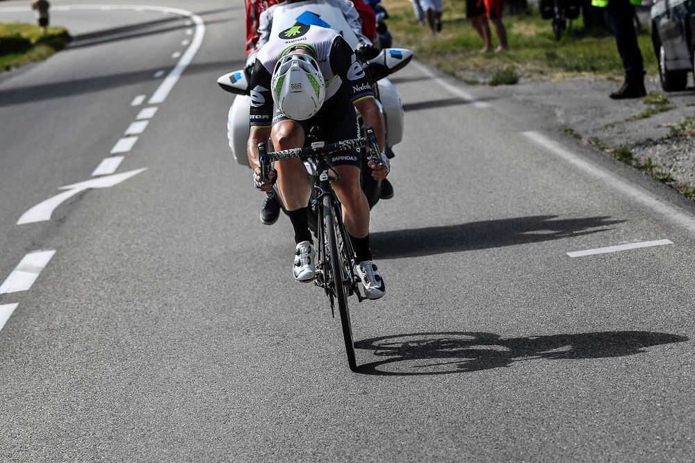 Mark Cavendish checks his bike near the end of stage 11 at the Tour de France