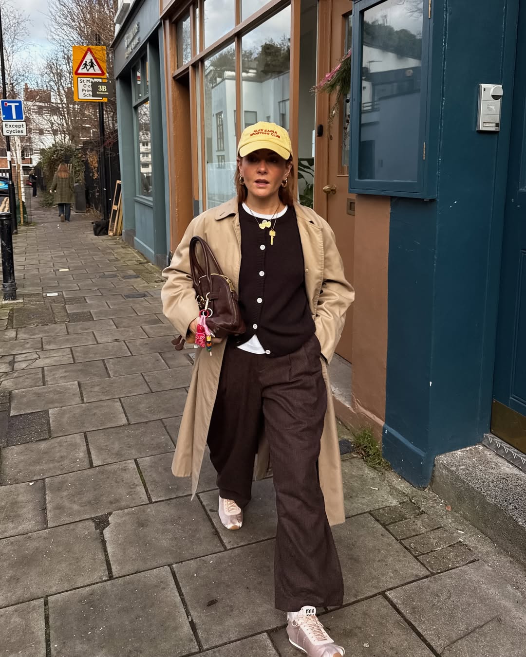 Influencer Rebecca Ferraz Wyatt wearing satin baby pink trainers.