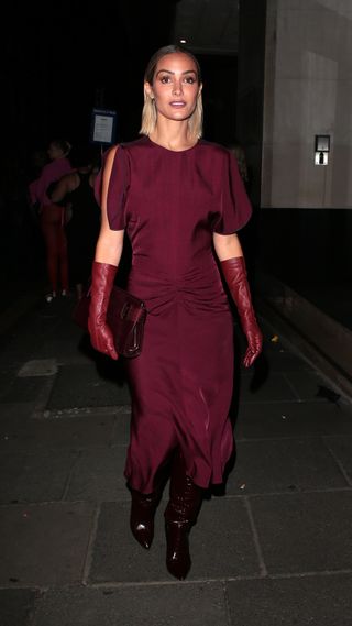 Frankie Bridge wearing burgundy dress