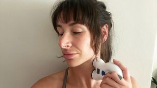 Tester Sam holding VNS to her neck during testing