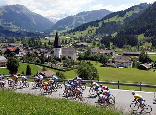 The peloton rides through the pristine Swiss countryside during stage 8