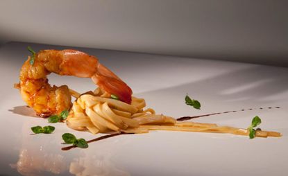 Heart of palm fettuccine with coral butter and glazed shrimp
