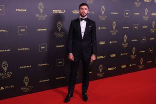 Manchester City's Portuguese defender Ruben Dias poses prior to the 2023 Ballon d'Or France Football award ceremony at the Theatre du Chatelet in Paris on October 30, 2023.