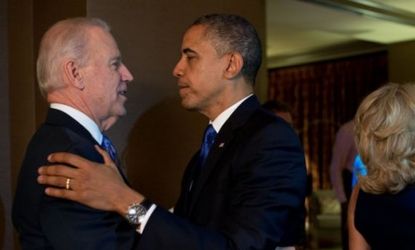 President Obama and Vice President Joe Biden embrace after television networks called the election in their favor on Tuesday night.